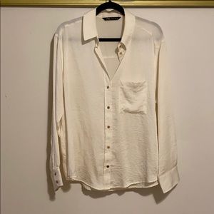 Cream colored button down shirt with pocket